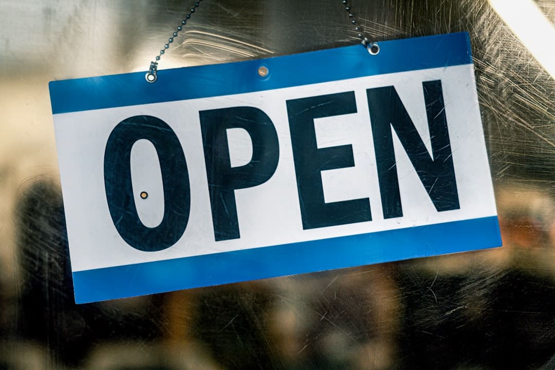 service dogs gyms — Open sign hanging on a glass door