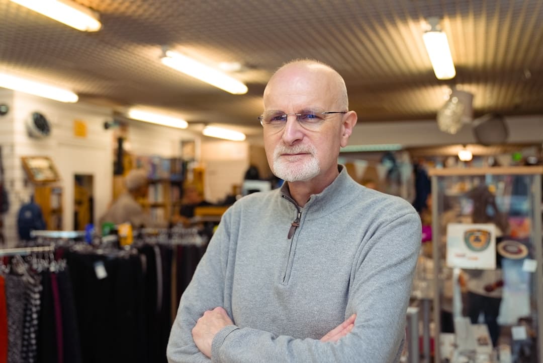 service dogs gyms — Bald man with glasses in a store