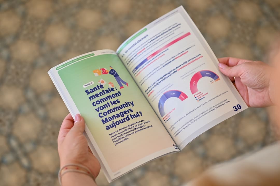 service dog etiquette. Person holding an open booklet with text and charts.