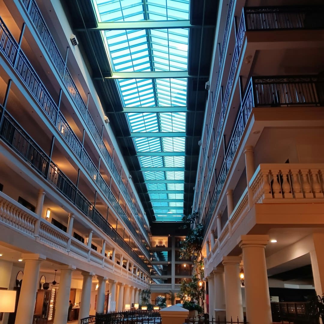 restaurant service dog — Interior atrium with a glass ceiling and balconies