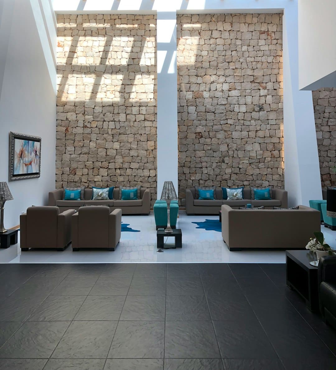retail service dog — a living room with two couches and a stone wall